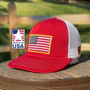 "Show your American pride with our Red Snapback Hat, a USA-made symbol of craftsmanship and patriotism, featuring an embroidered American flag."