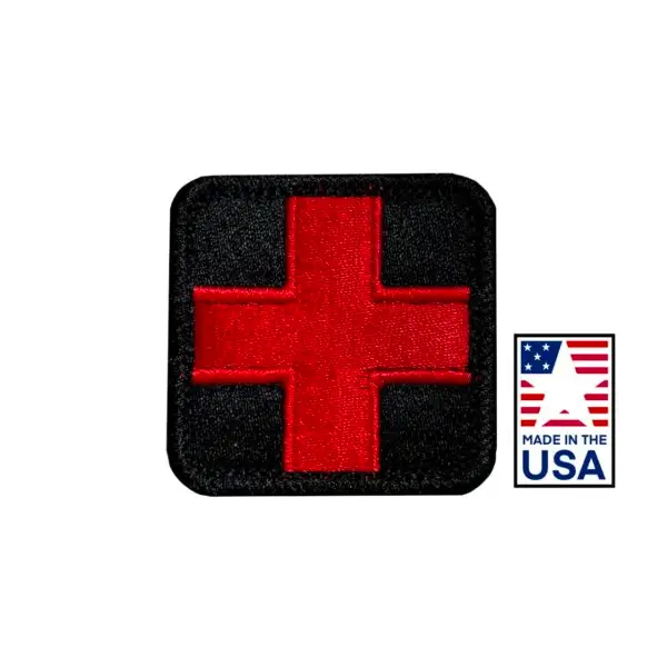 Black and red 2x2 inch embroidered medical patch featuring a red cross design, hook and loop backing, made in USA for healthcare uniforms.
