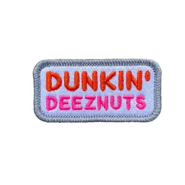 Vibrant 1.5x3 inch Dunkin' Deeznutz Morale Patch with hook and loop back, showcasing humorous design - ideal for backpack customization.