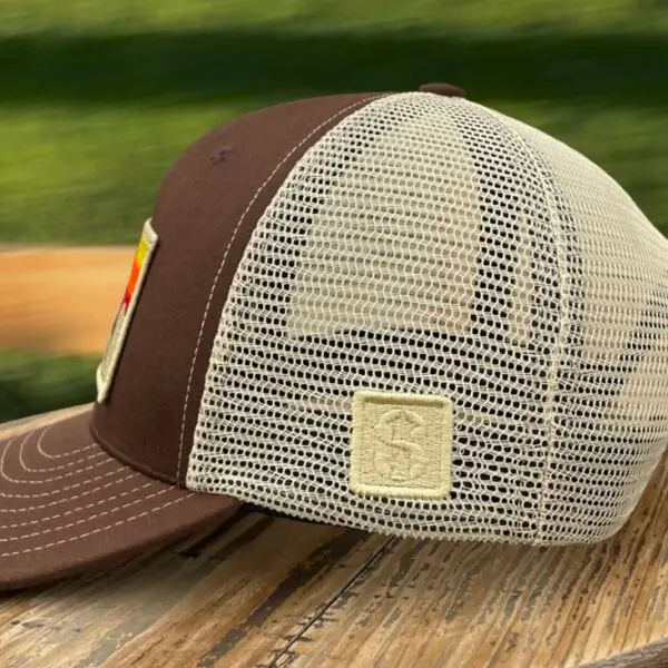 Image of a Brown Snapback Cap with American Bison Sunset Patch. USA-made, athletic fit, adjustable, perfect for active and patriotic styles.